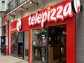 Помещение, арендуемое известной сетью пиццерий Telepizza, в Барселоне. Испания