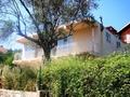 Двухэтажный дом, жилой площадью 166 кв.м., расположенный в красивой оливковой роще с видом на море и горы, в Баре. Черногория