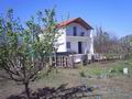 Новый двухэтажный дом, площадью 70 кв.м., с большим садом и выходом к реке, в Подгорице. Черногория